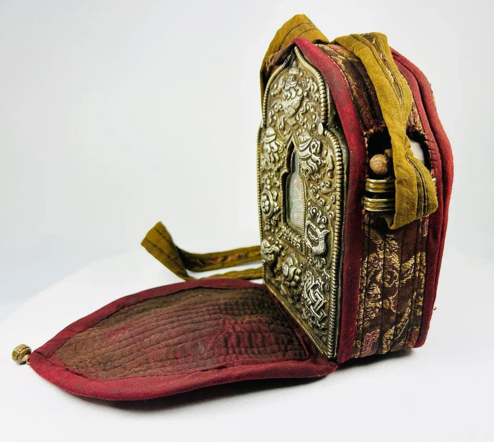 Antique Tibetan gau amulet box with lotus, endless knot, and Buddha figure