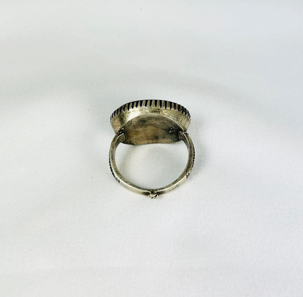 Antique Near Eastern carnelian intaglio ring, engraved motifs on red carnelian, silver mount, black display stand