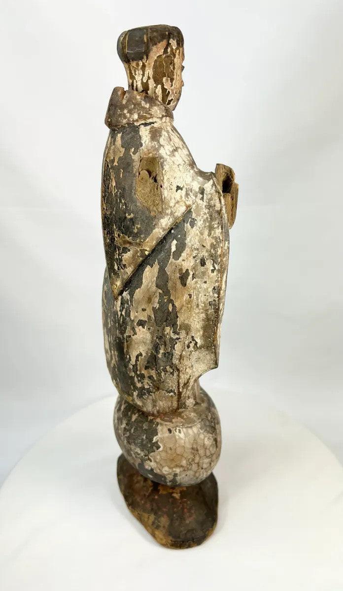 Colonial era carved wooden santo representing a Catholic friar, likely Franciscan or Dominican, with aged devotional wear.