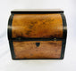 Front view of an early Georgian mahogany spirit box with arched lid and decorative black edging.