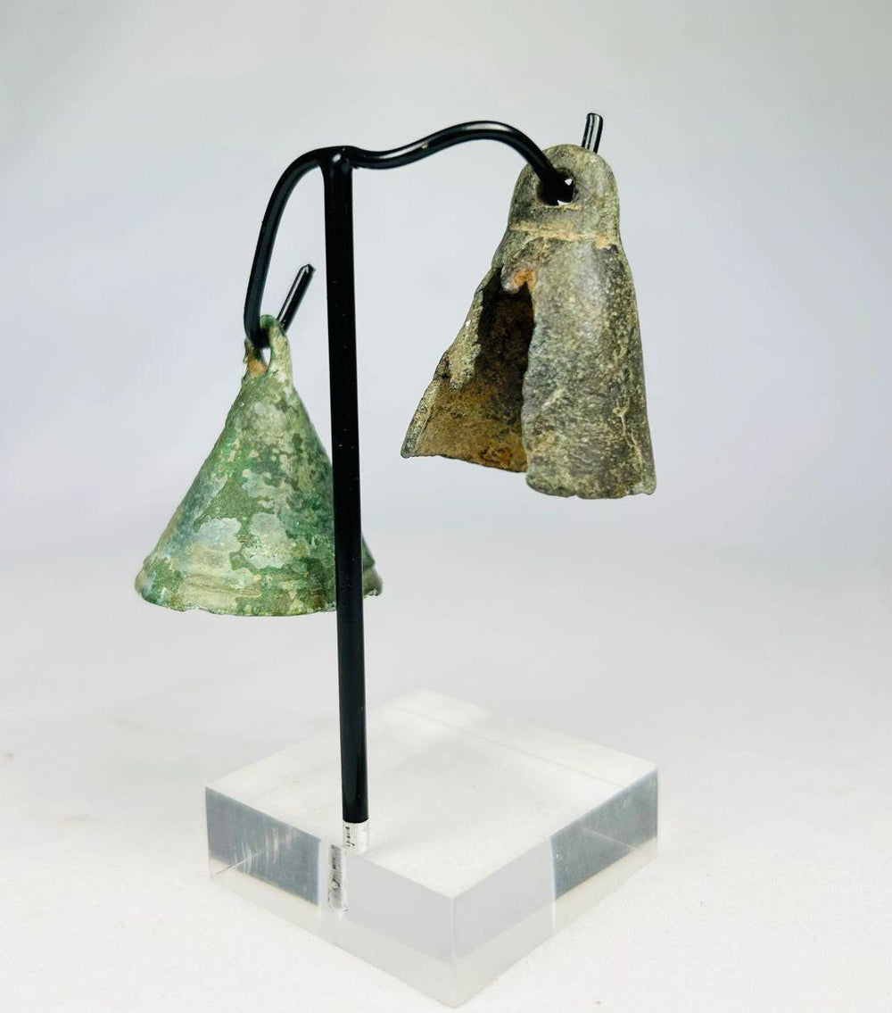 Antique Roman cast bronze bell with weathered surface and original hanging loop