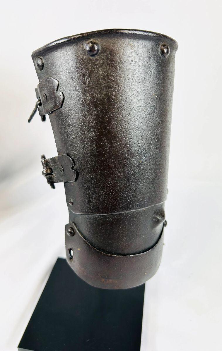 15th–16th century Continental armour vambrace, authentic medieval European forearm guard with original rivets and buckles on black display stand, Relic and Rarity.