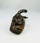 Bronze Buddha amulet pendant with sealed brass back and aged patina