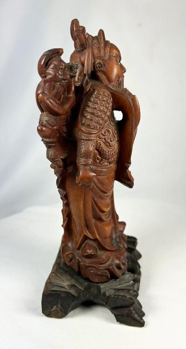 Qing Dynasty Chinese wood figure with detailed robes and symbolic weapon