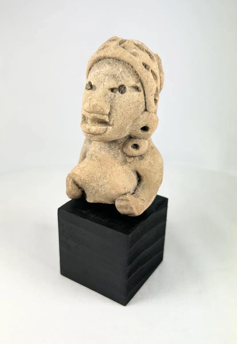 Ancient West Mexican shaft tomb figurine of a seated woman with exaggerated facial features