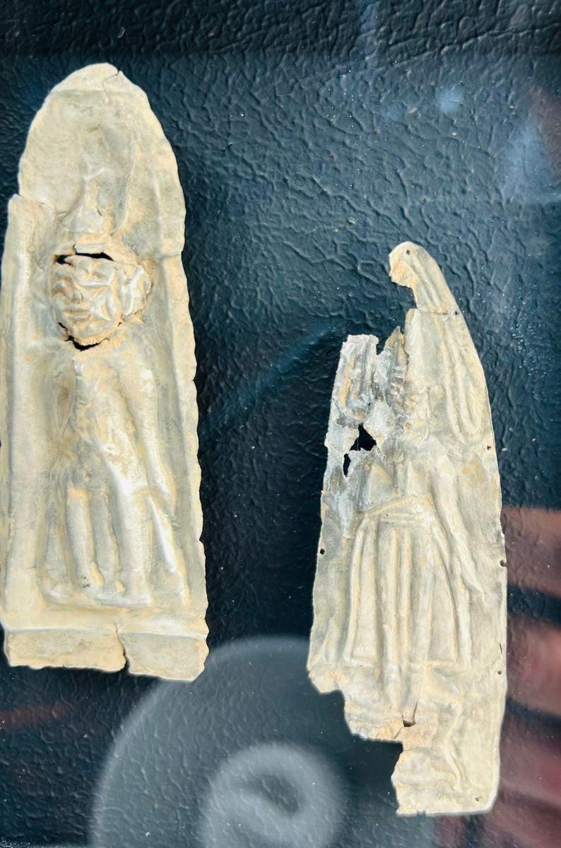 Antique cast metal plaques with Buddha and attendant figures in meditation