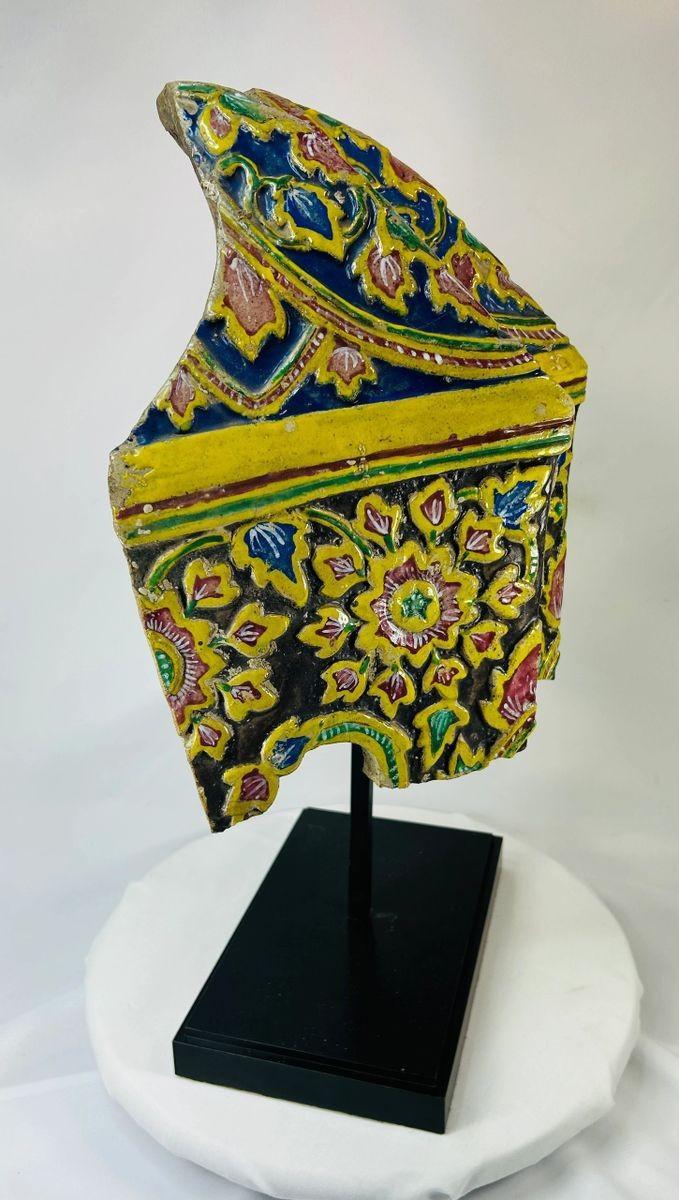 Polychrome Thai ceramic tile with vibrant multicolored patterns
