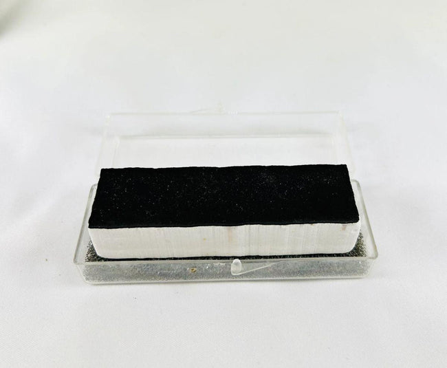 Authentic NASA Space Shuttle HRSI thermal protection tile, 1980s silica-ceramic block with black Reaction Cured Glass coating, used for reentry heat resistance.