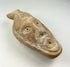 Ancient Byzantine terracotta oil lamp with molded human face spout