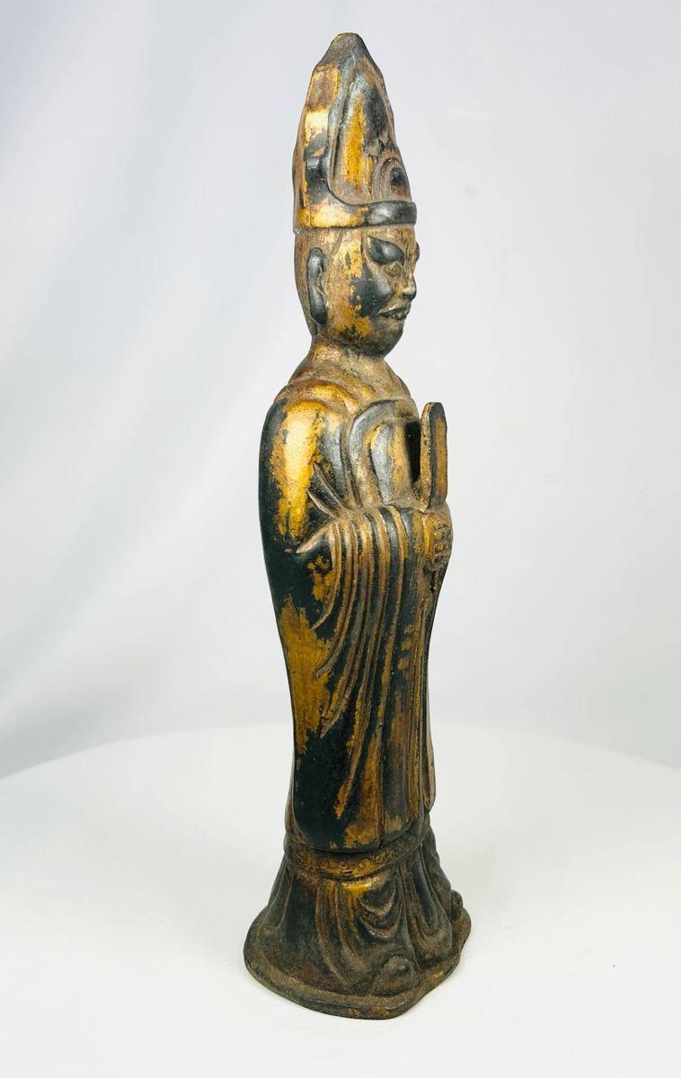 Tibetan Lama bronze statue showing traditional monastic attire and headdress