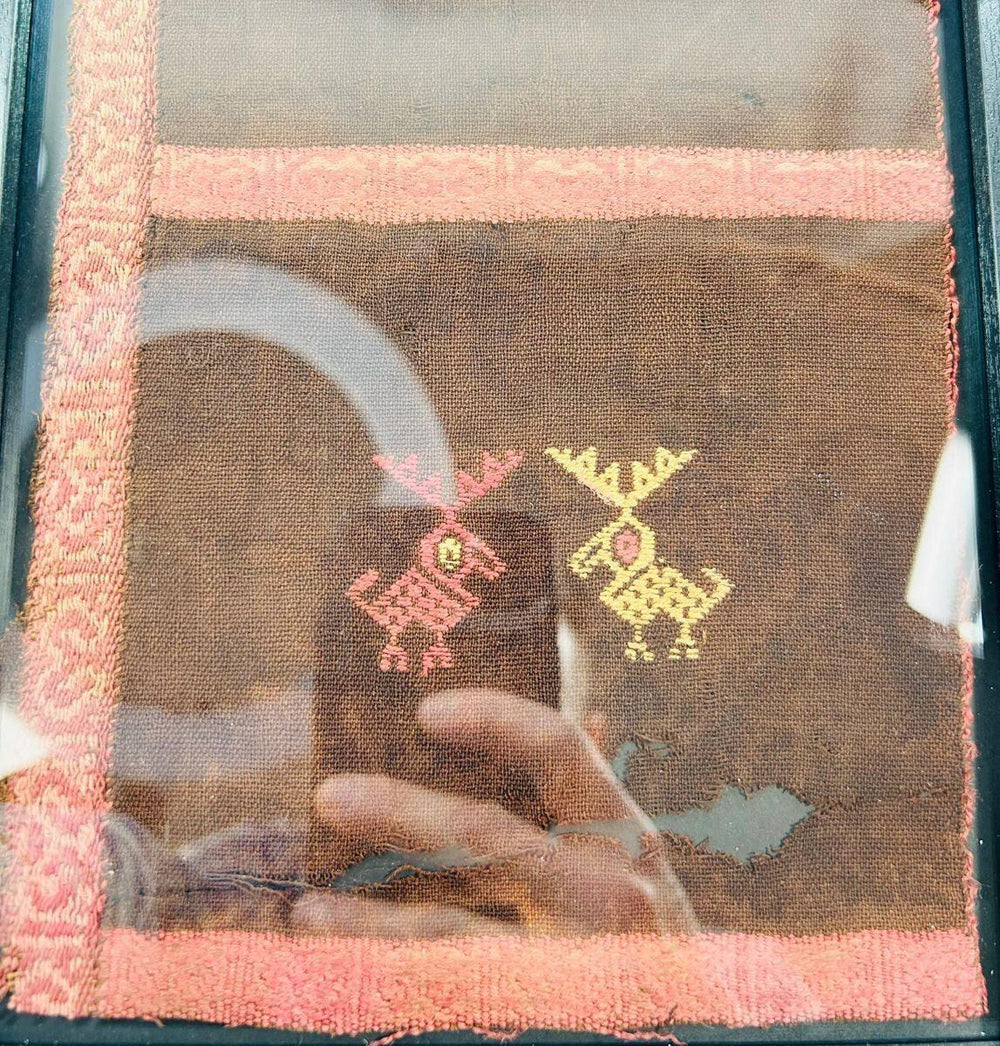 Textile fragment from ancient Peru with geometric animal embroidery