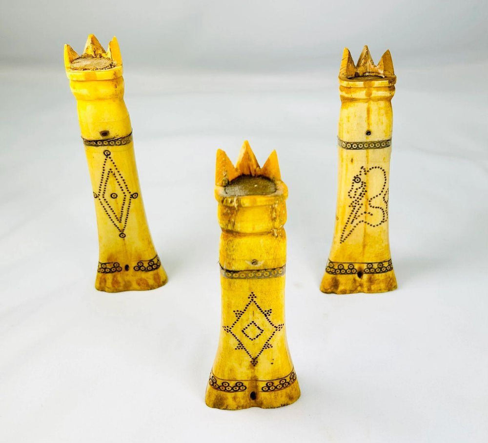 Indonesian buffalo bone lime holders featuring crowned royal figure lids