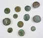 Collection of 12 ancient Roman bronze coins with imperial busts