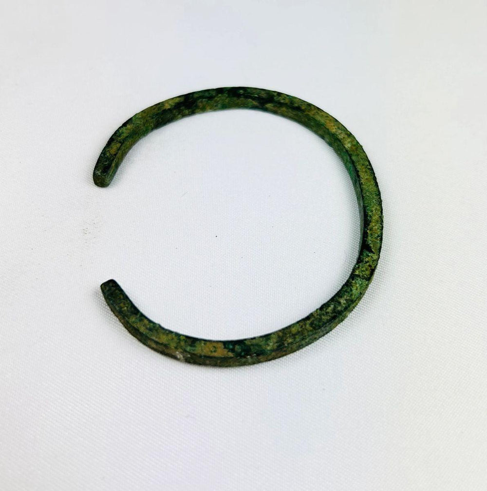 Ancient Near Eastern broad bronze cuff with green patina