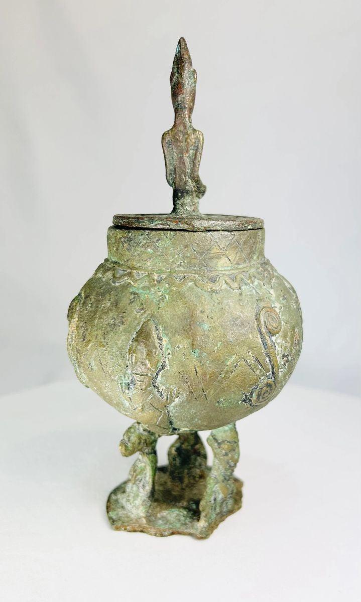Close-up of 19th-century Dogon bronze vessel highlighting traditional Mali craftsmanship.