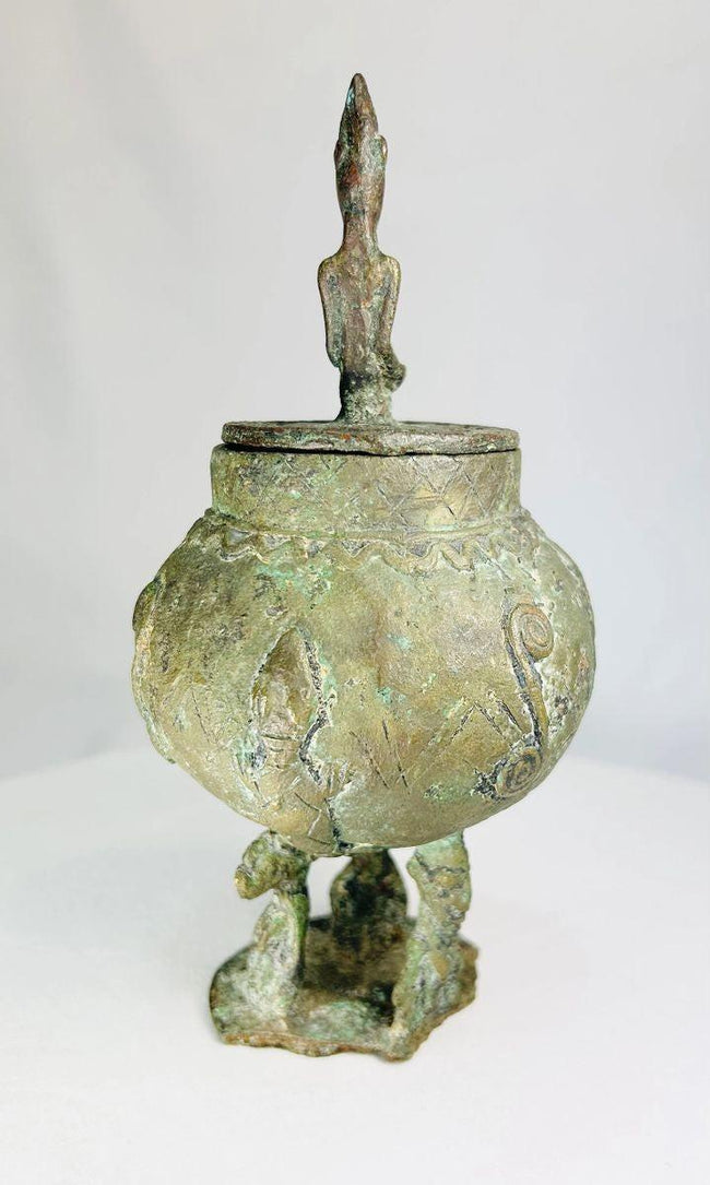 Close-up of 19th-century Dogon bronze vessel highlighting traditional Mali craftsmanship.