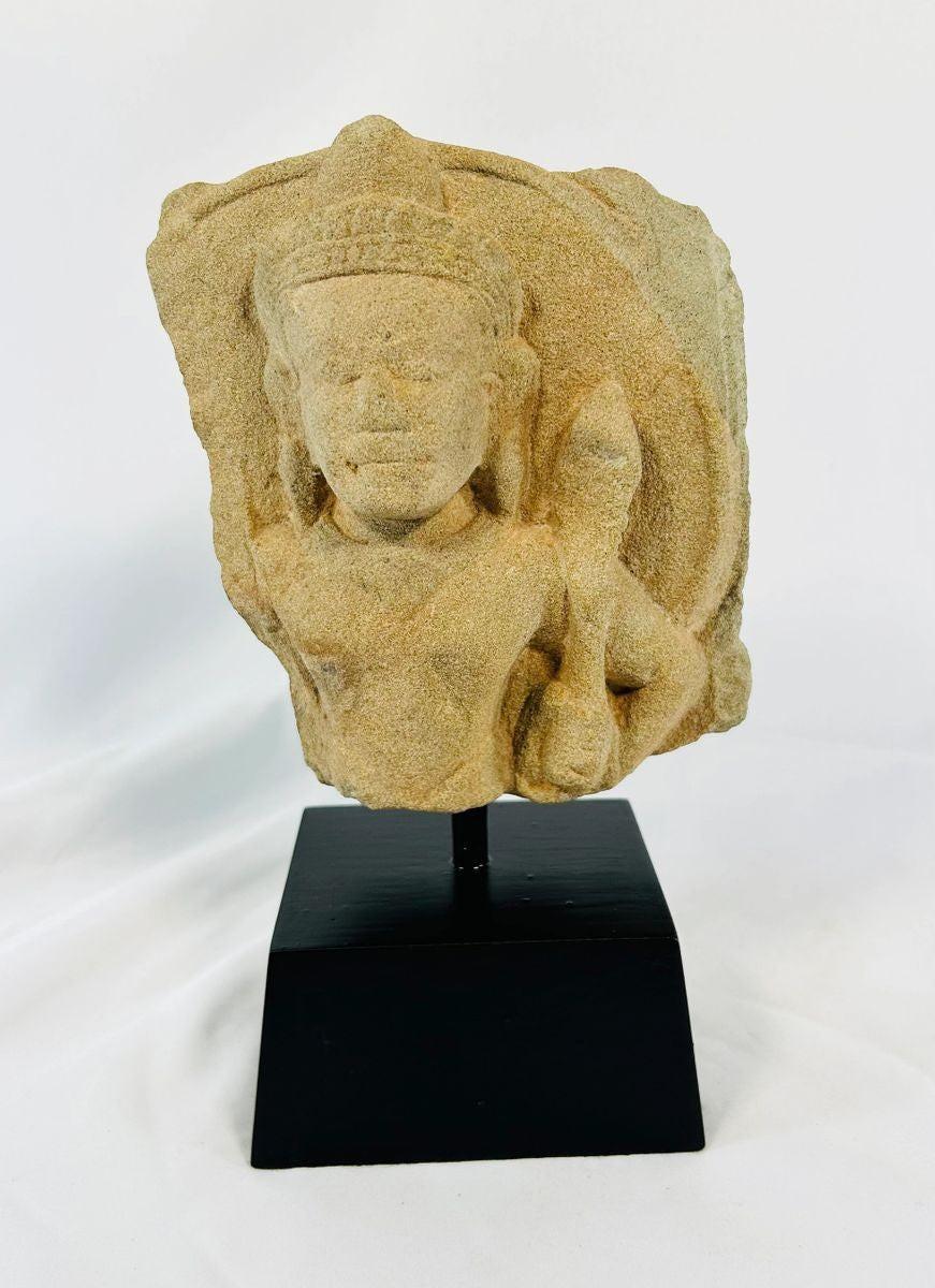 Close-up view of Khmer Empire Padmapani stone carving with natural patina and weathered surface