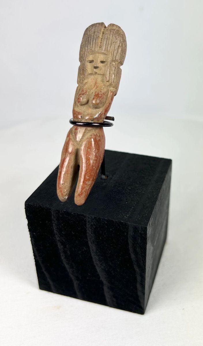 Classic period Veracruz terracotta figurine with ridged headdress and red slip remnants