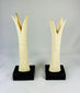 1070–664 BCE Egyptian ivory sistrum handles, Third Intermediate Period, carved stylized figures on display bases