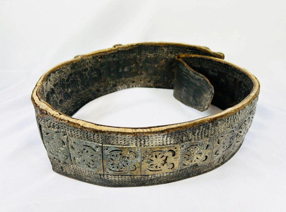 Back view of 17th–18th century Southern Russian Jewish bridal belt made of brass with pierced plates and inset carnelian gemstones.