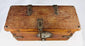 18th–19th century Himalayan wooden lockbox featuring circular iron hasp and ornate key.