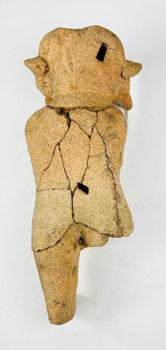 Ancient Mesoamerican figurative ceramic artifact photographed against a neutral background