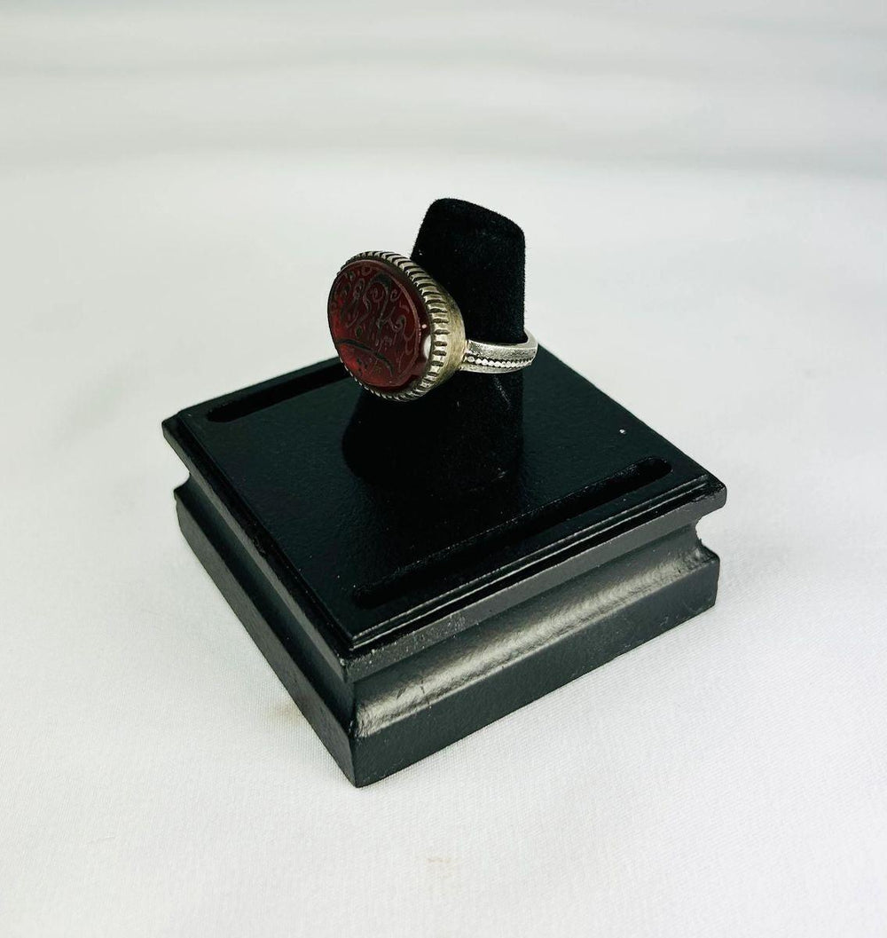 1st millennium BCE carnelian intaglio ring, Ancient Near East, silver bezel, finely detailed animal and symbolic carvings