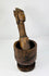 Finely carved wooden pestle paired with robust European mortar