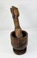 Finely carved wooden pestle paired with robust European mortar