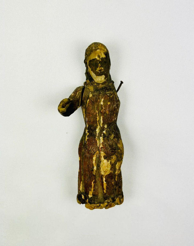 Detail of carved garments and facial features on a Spanish Colonial devotional sculpture