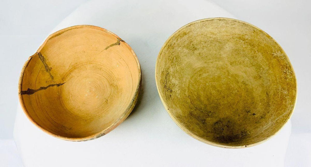 Ancient Harappan bowls exhibiting natural and painted surfaces