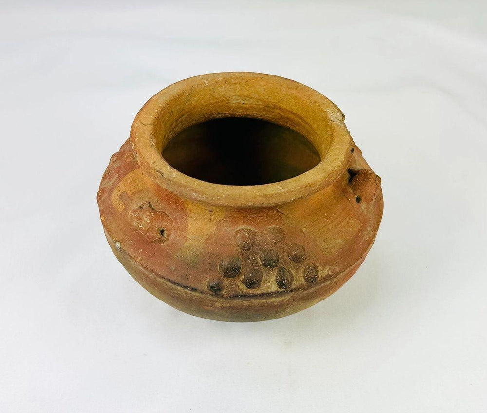 Ancient Mesoamerican or Andean clay vessel with raised decorative clusters