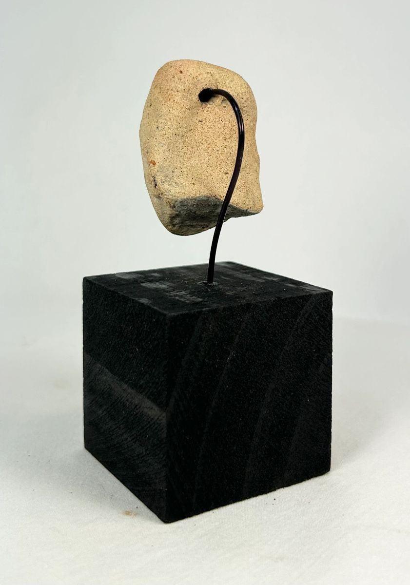 Ancient Mesoamerican terracotta pendant with incised almond eyes