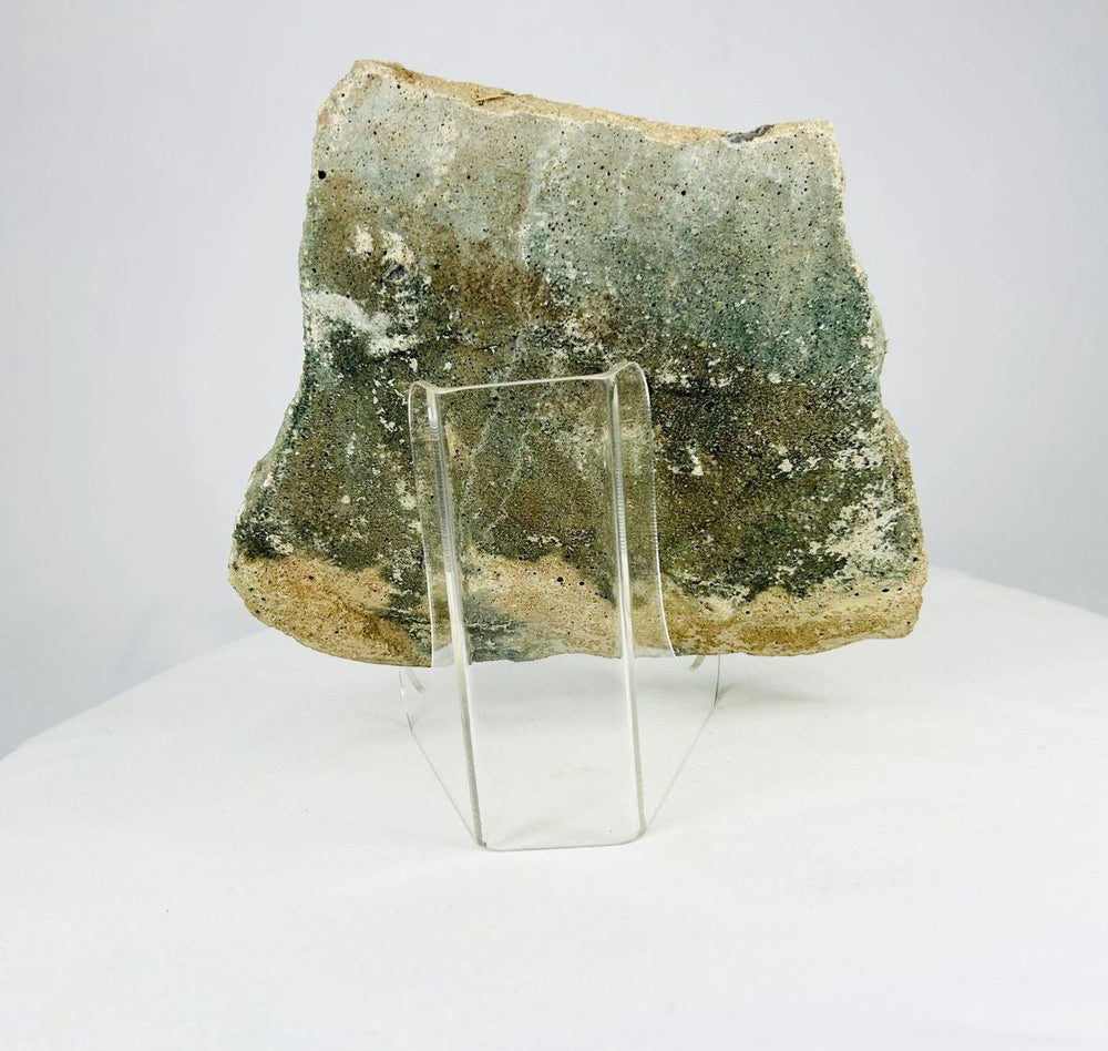 Ancient Mediterranean limestone fragment with weathered surface and centuries-old patina