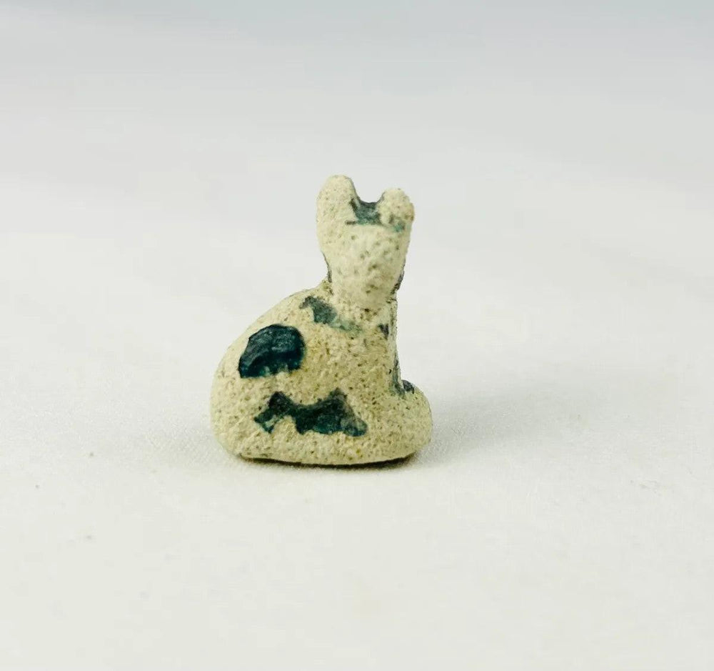 Egyptian faience cat goddess amulet with three scarabs symbolizing protection and rebirth, circa 600–200 BCE