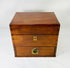 Closed antique Victorian apothecary box made of polished mahogany wood with brass keyholes and fittings, late 19th century chemist’s kit.