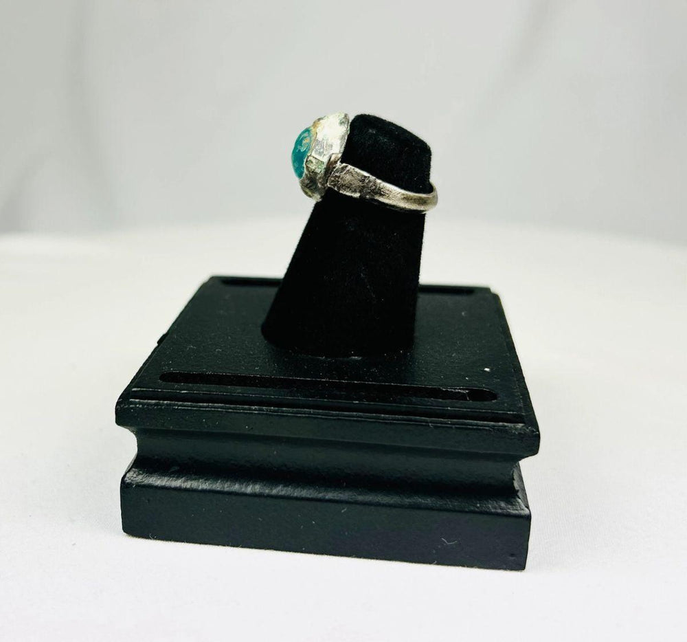 Silver ring featuring engraved horse and rider with raised turquoise bezel from antiquity