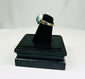Silver ring featuring engraved horse and rider with raised turquoise bezel from antiquity