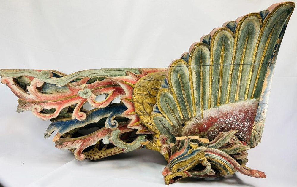 Front angle of Qing Dynasty phoenix relief hand-carved from camphor wood, featuring intricate gilded feathers, red and blue polychrome details, and cloud motifs – Relic and Rarity.
