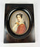 Signed miniature portrait of a woman with roses, gouache on ivory or wafer