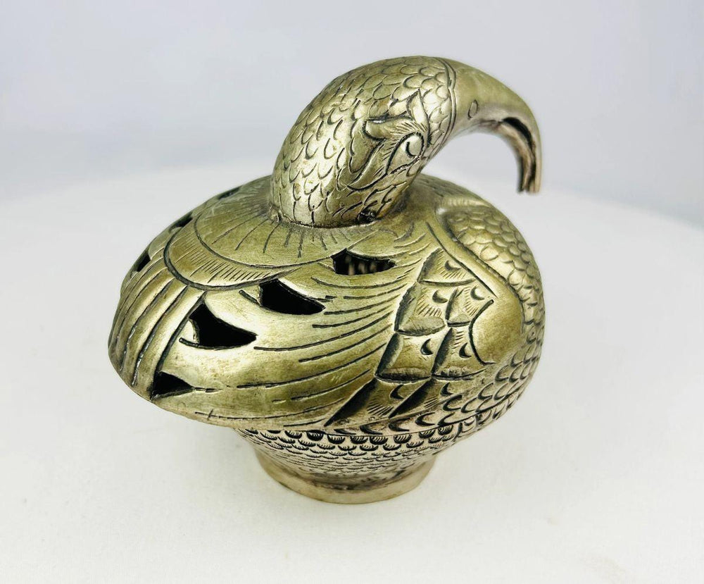 Antique bronze peacock censer with detailed plumage and curved beak
