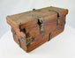Antique wooden merchant lockbox with perforated iron hasp plate and aged surface wear.