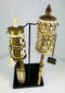 Tibetan Buddhist prayer wheels with Buddha figure and mantra script