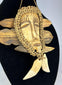 Mid-century Congo Lega pendant mask with carved face and fiber details
