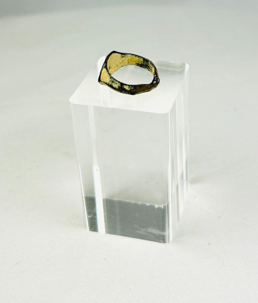 Angled view highlighting the weight and craftsmanship of a Roman bronze signet ring
