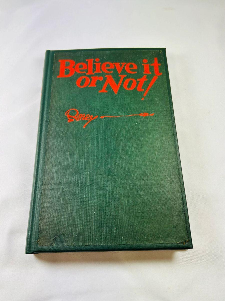 Detailed view of Robert Ripley’s autograph and personal note inside 1929 Believe It or Not! first edition hardcover.