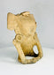 Authentic pre-Columbian clay figurine with symbolic seated pose and hollow cavity, reflecting Classic Period Mesoamerican religious practices