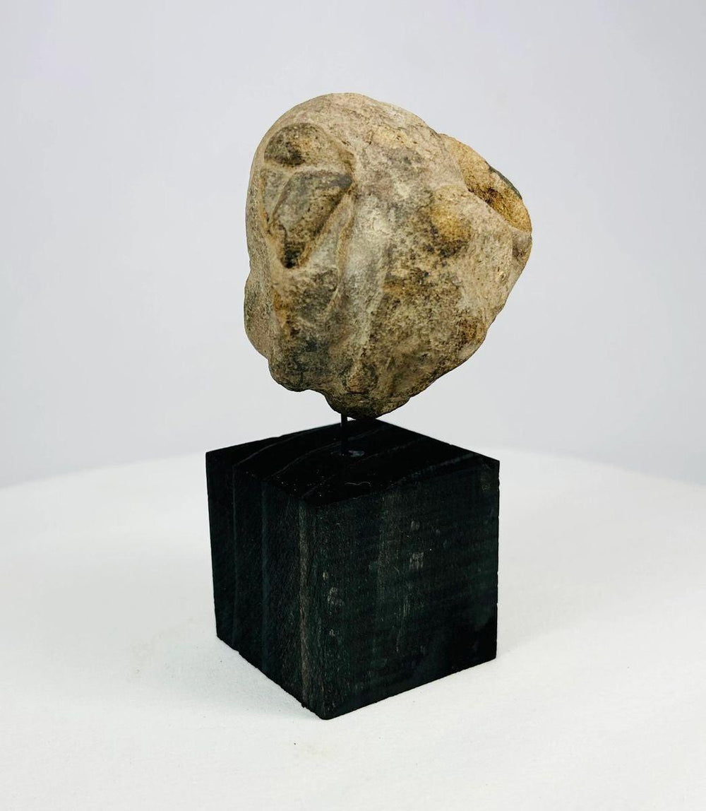 Mesoamerican stone mask dating to 500 BCE–500 CE with narrow eye slits