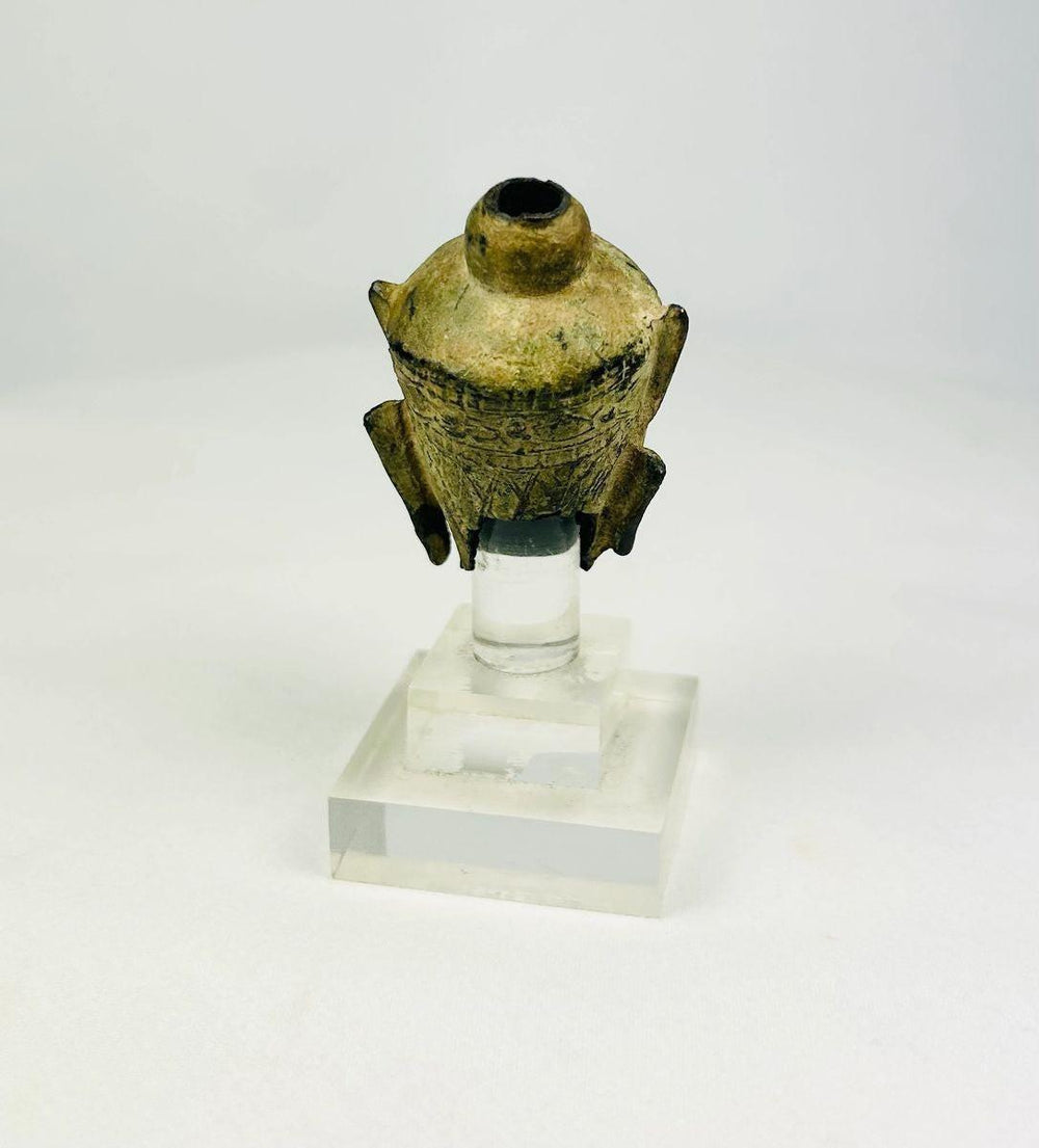 Rear view highlighting casting surface and patina on a bronze Buddha head