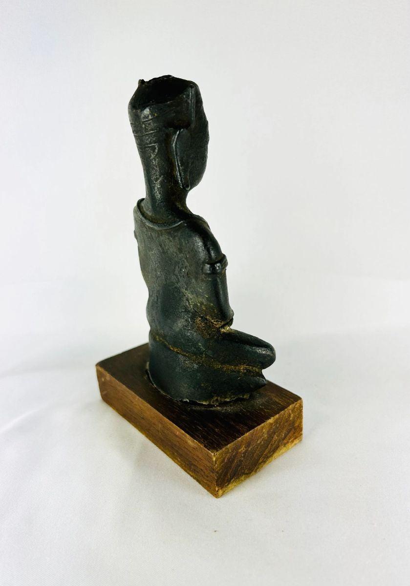 Traditional Southeast Asian seated Buddha sculpture with dhyana mudra and elongated earlobes